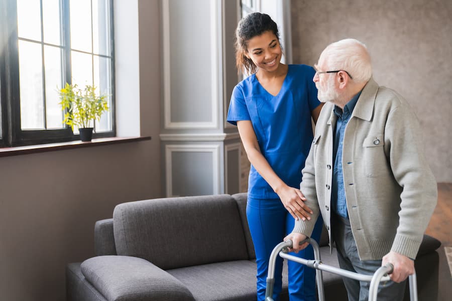 Caregiver helping elderly person